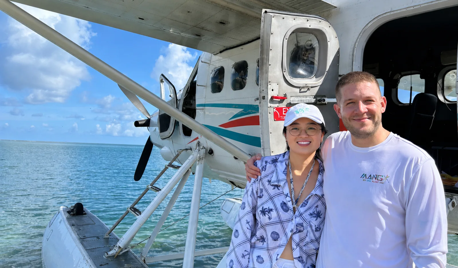 Fitz and Yaxuan beside a seaplane